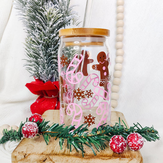 Gingerbread Men and pink candy cane design on a glass cup made by Addison Charles design