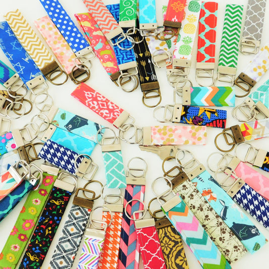 flatlay of multiple colorful key fob keychains